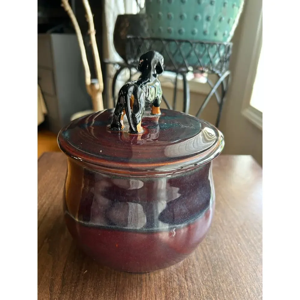 Mudipaws Pottery ceramic treat jar topped w/ a dachshund by artist Debi Manduca